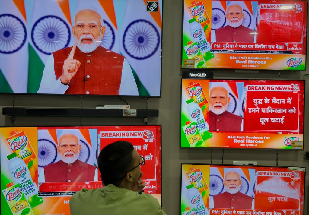 A man watches the live telecast of Indian Prime Minister Narendra Modi’s speech on television screens in Prayagraj, Uttar Pradesh, India, on Monday. Photo: AP A man watches the live telecast of Indian Prime Minister Narendra Modi’s speech on television screens in Prayagraj, Uttar Pradesh, India, on Monday. Photo: AP
