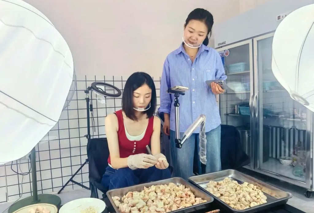 Wang Yuxian, left, carefully plucks away at piles of chicken pieces during a live-stream. Photo: QQ.com Wang Yuxian, left, carefully plucks away at piles of chicken pieces during a live-stream. Photo: QQ.com