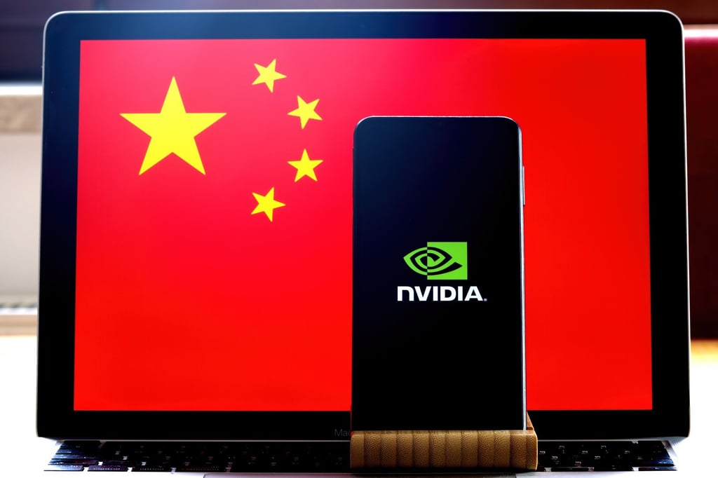 The Nvidia logo is displayed on a phone screen, with the Chinese flag in the background. Photo: Shutterstock Images The Nvidia logo is displayed on a phone screen, with the Chinese flag in the background. Photo: Shutterstock Images