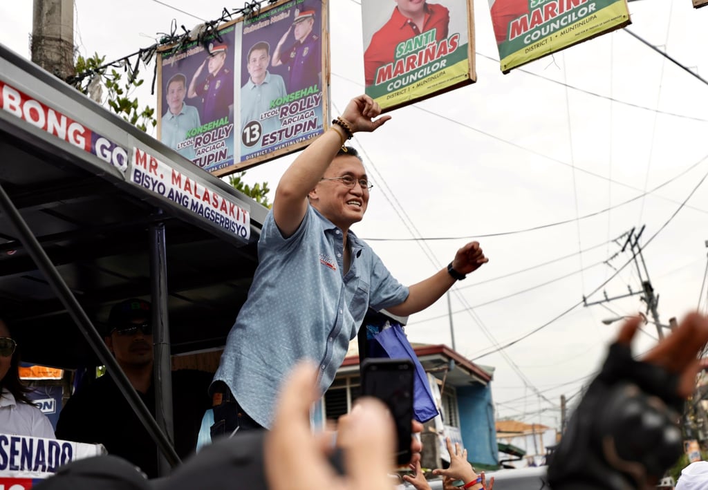 Senator Bong Go (centre) gestures during a motorcade in Manila, the Philippines, on May 7. He is among the 15 candidates named in the complaint. Photo: EPA-EFE Senator Bong Go (centre) gestures during a motorcade in Manila, the Philippines, on May 7. He is among the 15 candidates named in the complaint. Photo: EPA-EFE
