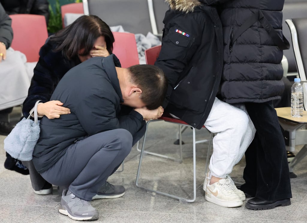 Family members of a victim of the Jeju Air plane crash grieve at Muan International Airport in South Korea on December 29 last year. Photo: Yonhap/EPA-EFE Family members of a victim of the Jeju Air plane crash grieve at Muan International Airport in South Korea on December 29 last year. Photo: Yonhap/EPA-EFE