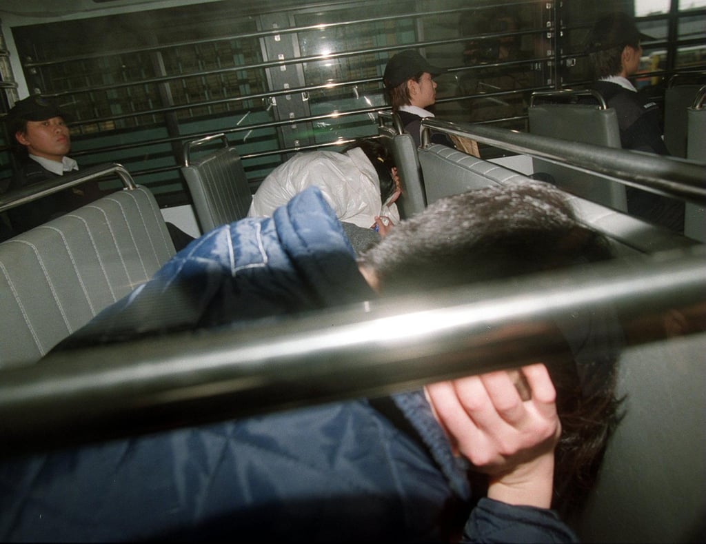 Two of the six teenagers given life sentences in the torture-killing of Luk Chi-wai are driven away in a police van. Photo: SCMP Archives