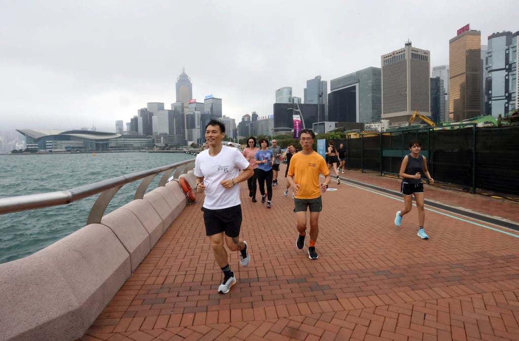 Wong (left) leads a running class in Central. Photo: Jonathan Wong Wong (left) leads a running class in Central. Photo: Jonathan Wong