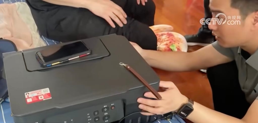 The police seized a printer, paper cutters and ink when they raided the couple’s home. Photo: CCTV