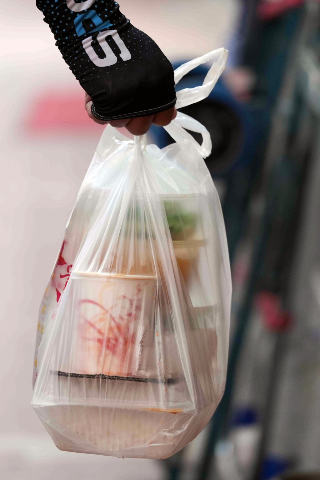 A delivery man carries a bag of takeaway food during lunch hour in Causeway Bay. Photo: Eugene Lee A delivery man carries a bag of takeaway food during lunch hour in Causeway Bay. Photo: Eugene Lee