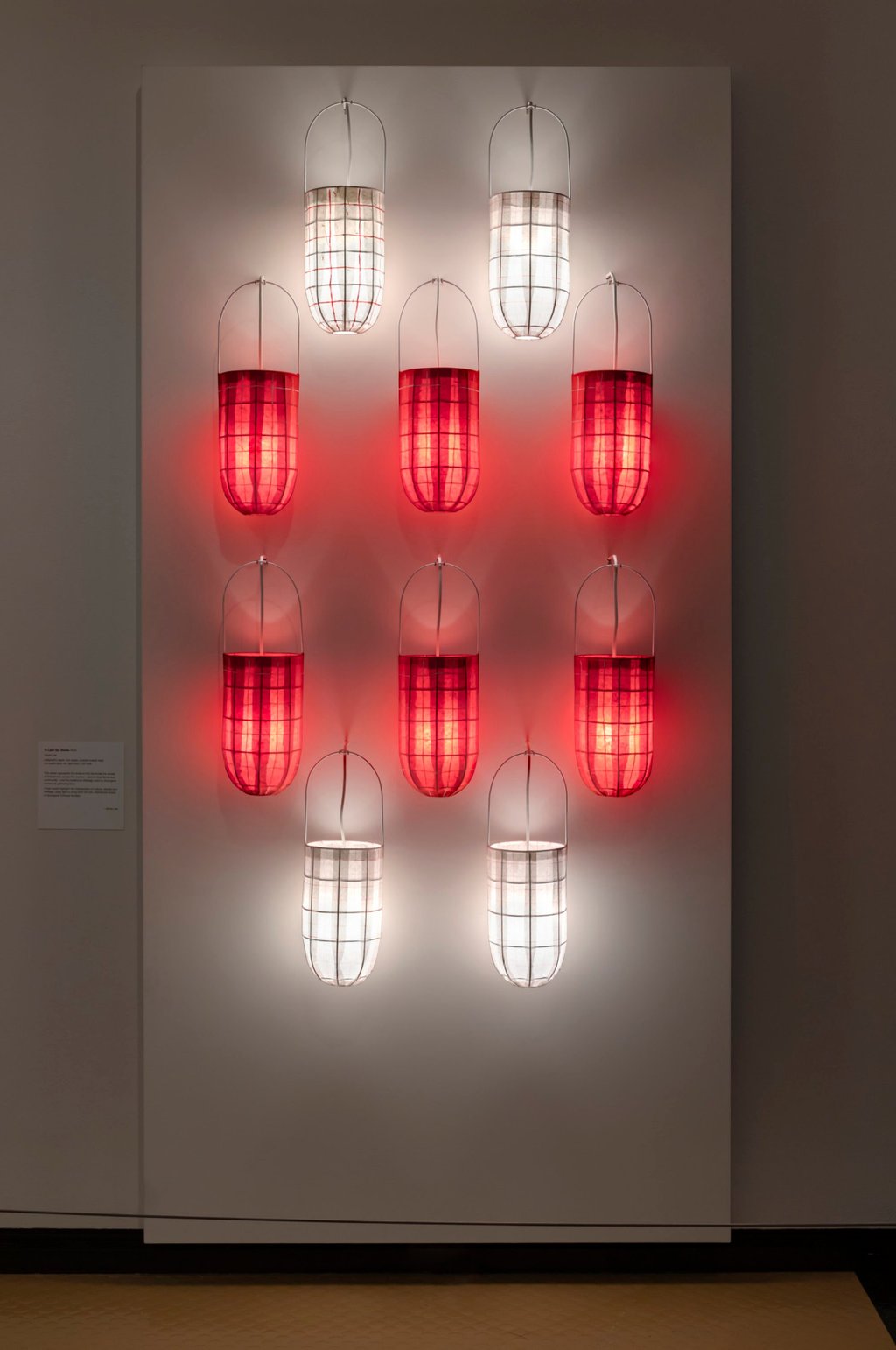 Jenna Lee’s installation in the exhibition, To Light Up: Stories, features a selection of dillybags made from white and red rice and calligraphy paper that are lit from within. Photo: National Museum of Australia Jenna Lee’s installation in the exhibition, To Light Up: Stories, features a selection of dillybags made from white and red rice and calligraphy paper that are lit from within. Photo: National Museum of Australia
