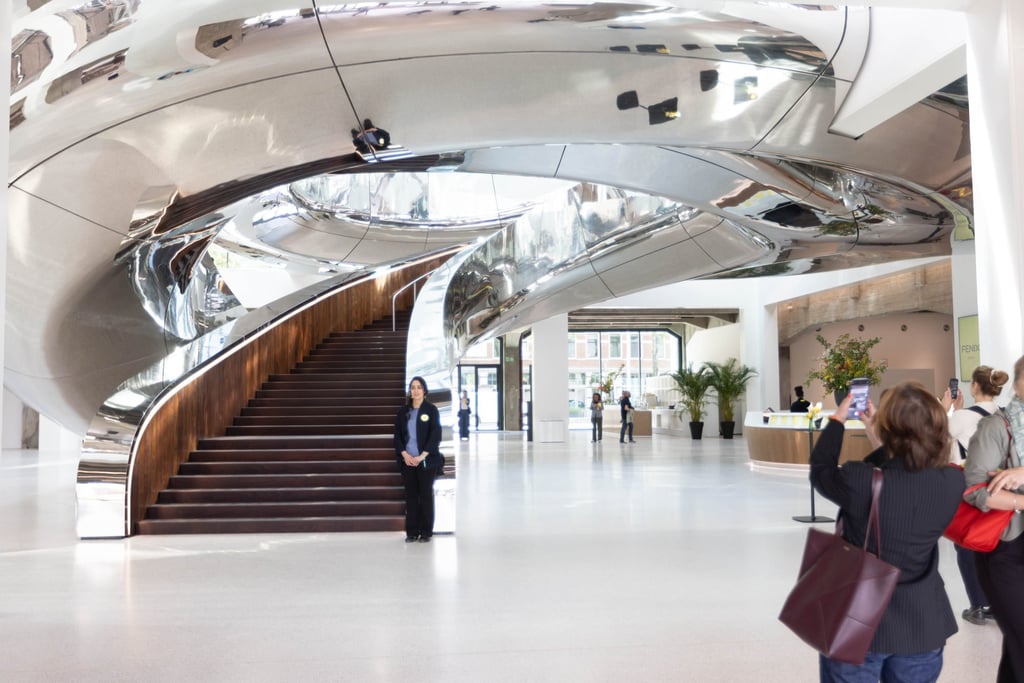 Visitors photograph the spiral staircase during a preview ahead of the museum’s opening. Photo: Xinhua