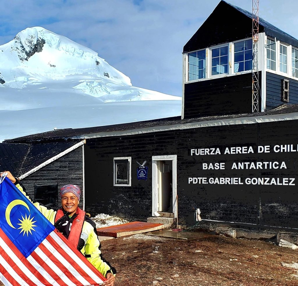 Anita Yusof flying the Malaysian flag in Antarctica. Photo: Anita Yusof Anita Yusof flying the Malaysian flag in Antarctica. Photo: Anita Yusof