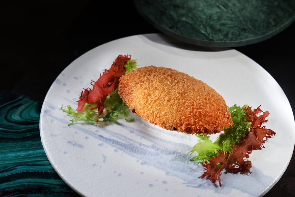 The signature golden stuffed crabmeat dish exemplifies the chefs’ attention to detail and commitment to flavour. The signature golden stuffed crabmeat dish exemplifies the chefs’ attention to detail and commitment to flavour.