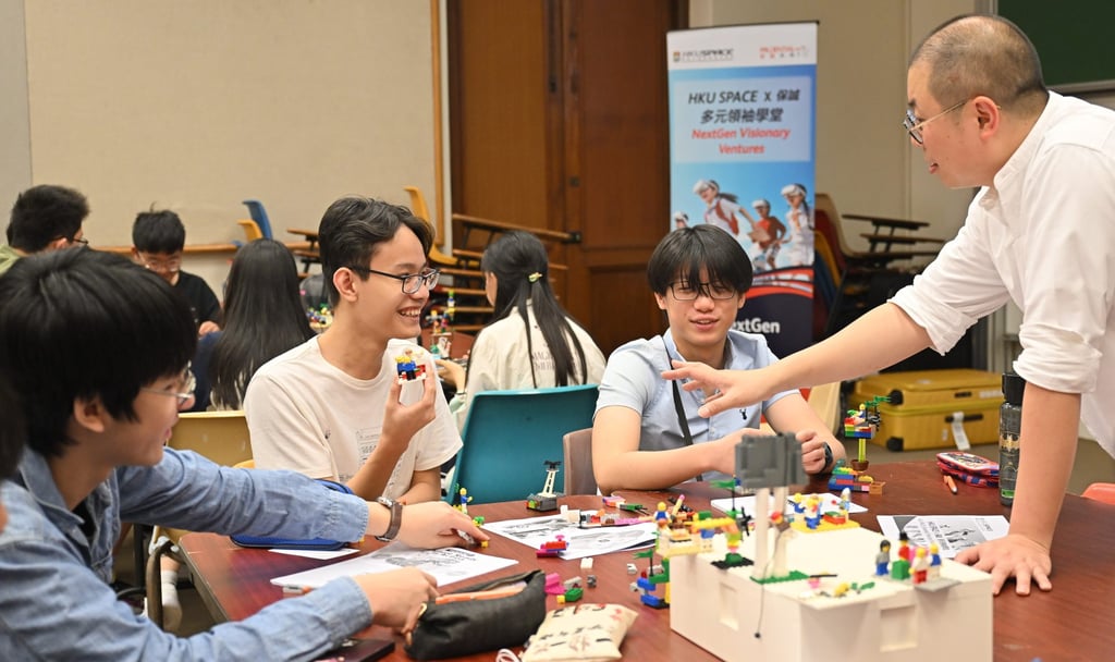 Workshop participants use Lego bricks to stimulate imagination, innovation and collaboration. Workshop participants use Lego bricks to stimulate imagination, innovation and collaboration.