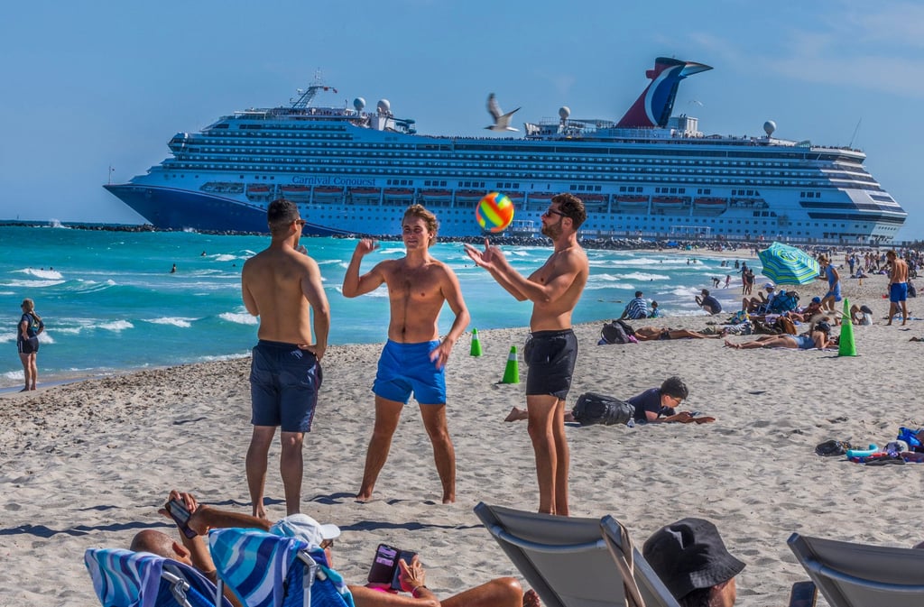 Carnival Cruises’ Carnival Conquest ship departs from PortMiami as beachgoers enjoy the nice weather at Miami’s South Beach during spring break on March 21, 2025. Photo: TNS Carnival Cruises’ Carnival Conquest ship departs from PortMiami as beachgoers enjoy the nice weather at Miami’s South Beach during spring break on March 21, 2025. Photo: TNS