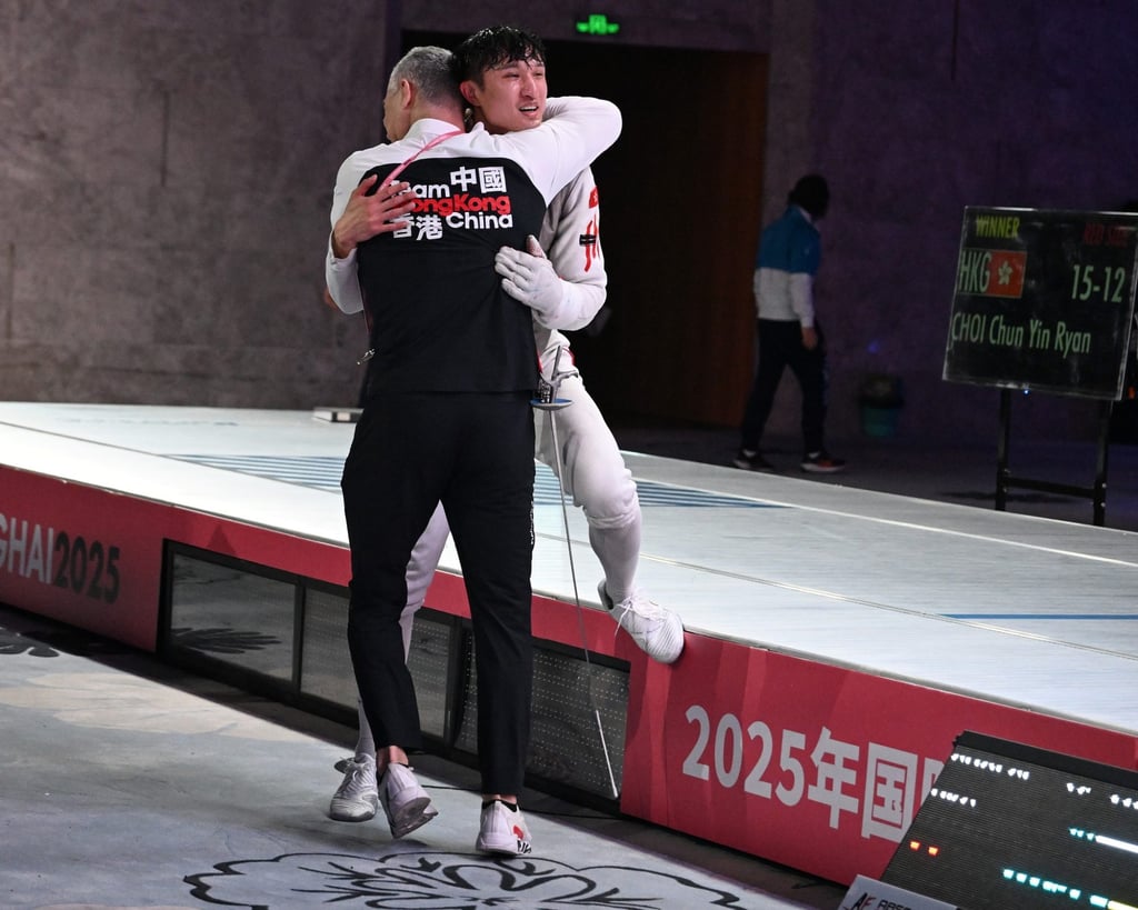 Ryan Choi hugs coach Maurizio Zomparelli after his Grand Prix win. Photo: FIE Ryan Choi hugs coach Maurizio Zomparelli after his Grand Prix win. Photo: FIE