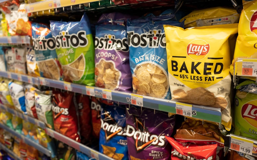 Potato and tortilla chips, an ultra-processed food, are displayed in a pharmacy in New York. Photo: AP Potato and tortilla chips, an ultra-processed food, are displayed in a pharmacy in New York. Photo: AP