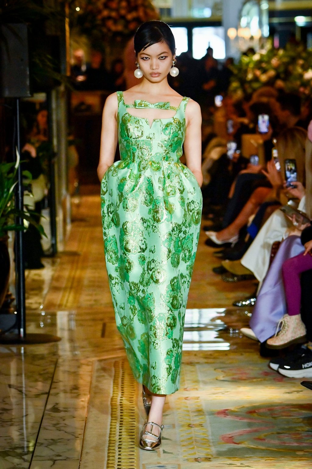 A model walks the runway at the Huishan Zhang autumn/winter 2025 show wearing oversized pearl earrings. Photo: Huishan Zhang