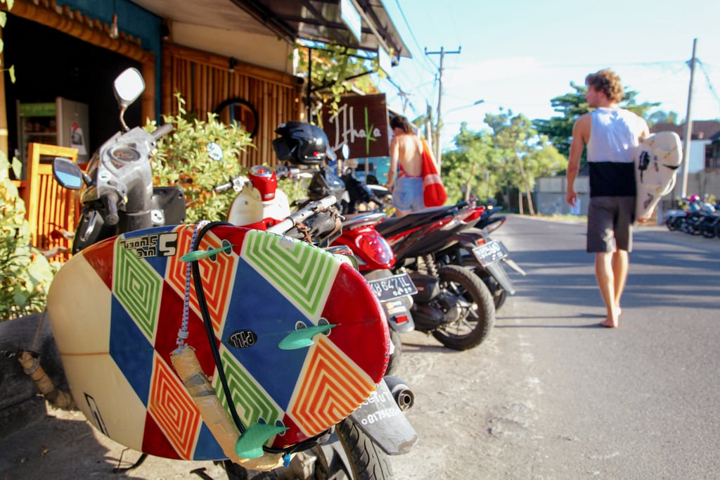 A barefoot surfer walking to the beach in Canggu. Photo: Ian Neubauer A barefoot surfer walking to the beach in Canggu. Photo: Ian Neubauer