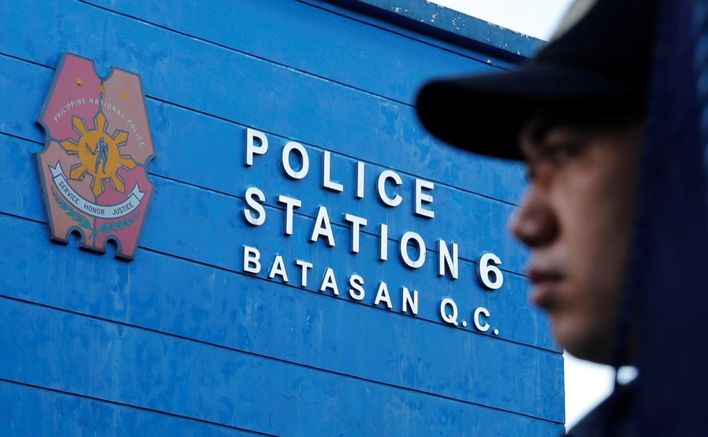A Filipino policeman stands outside a police station in Quezon City, Metro Manila. Photo Reuters A Filipino policeman stands outside a police station in Quezon City, Metro Manila. Photo Reuters