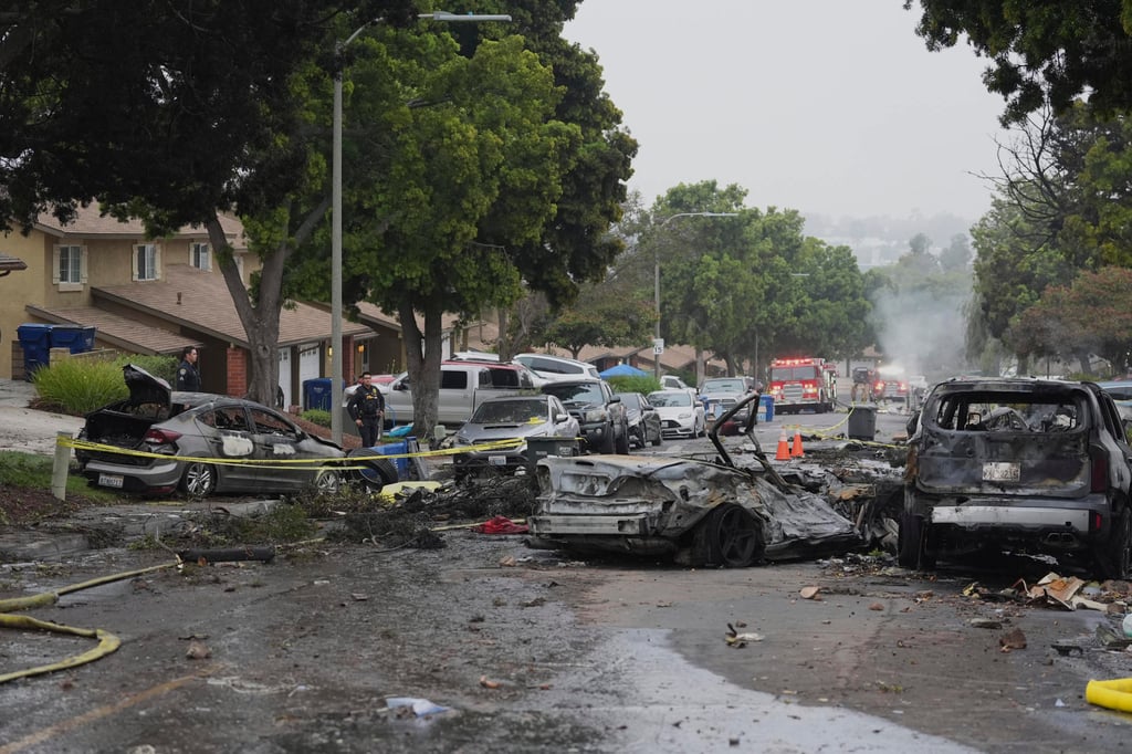 Cars set ablaze in the fiery crash. Photo: AP