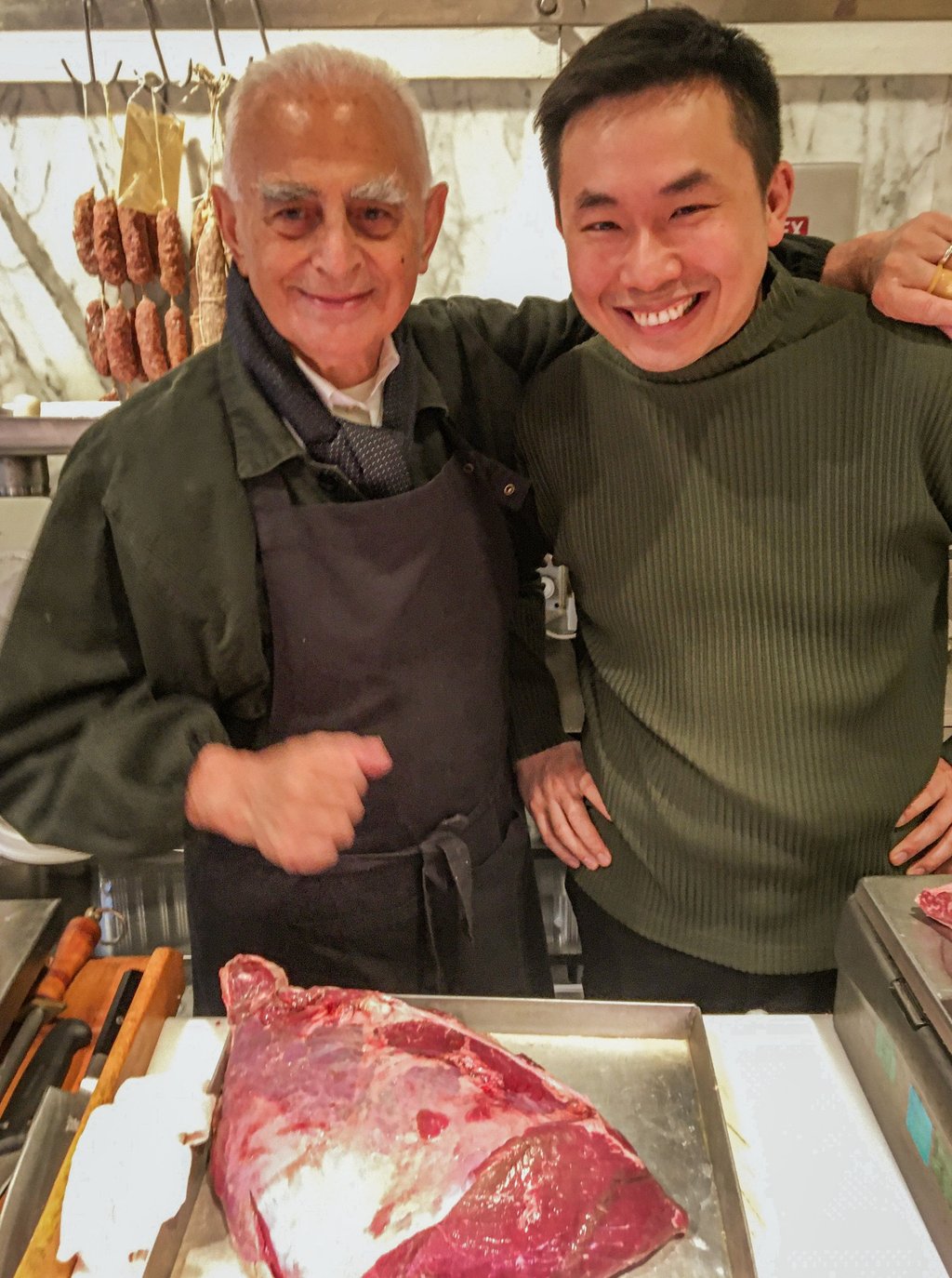 At the former Macelleria Sirtori butcher’s shop, now Ravioleria Sarpi, Agie Zhou (right) poses with Walter Sirtori, the retired master butcher who still selects the meat for Zhou’s Chinatown restaurant. Photo: John Brunton