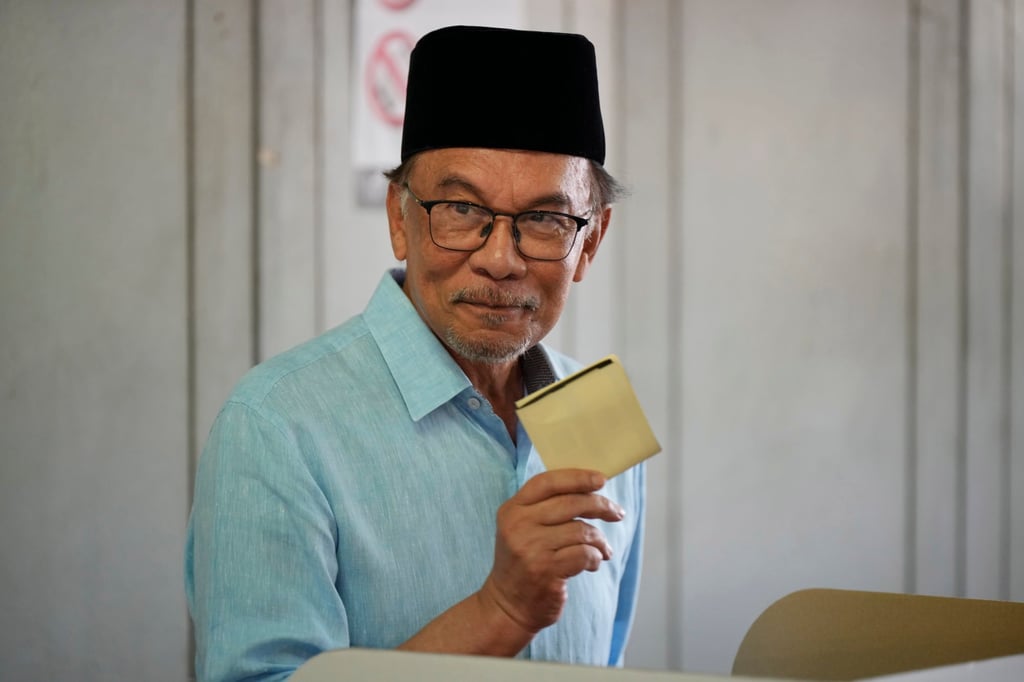 Anwar Ibrahim shows his ballot at a polling station during the 2022 election. Photo: AP Anwar Ibrahim shows his ballot at a polling station during the 2022 election. Photo: AP