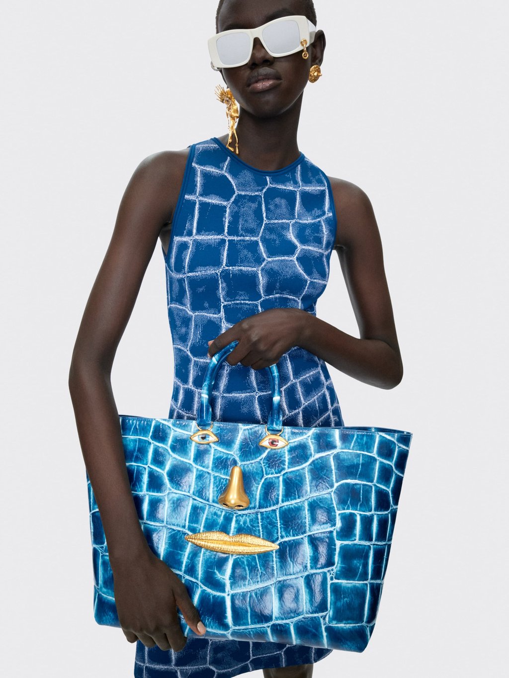 You won’t get lost in the crowd wearing this Schiaparelli dress and matching bag made from crocodile-embossed calf leather. Photo: Handout You won’t get lost in the crowd wearing this Schiaparelli dress and matching bag made from crocodile-embossed calf leather. Photo: Handout