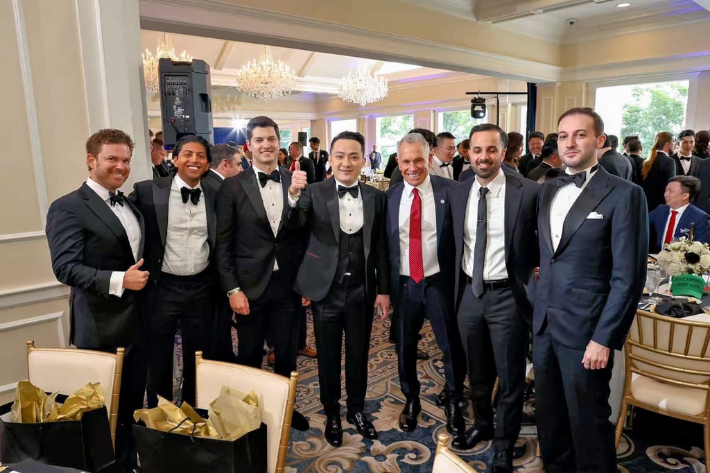 Justin Sun (centre) poses with other attendees at Trump’s dinner for top holders of his cryptocurrency. Photo: Justin Sun Justin Sun (centre) poses with other attendees at Trump’s dinner for top holders of his cryptocurrency. Photo: Justin Sun