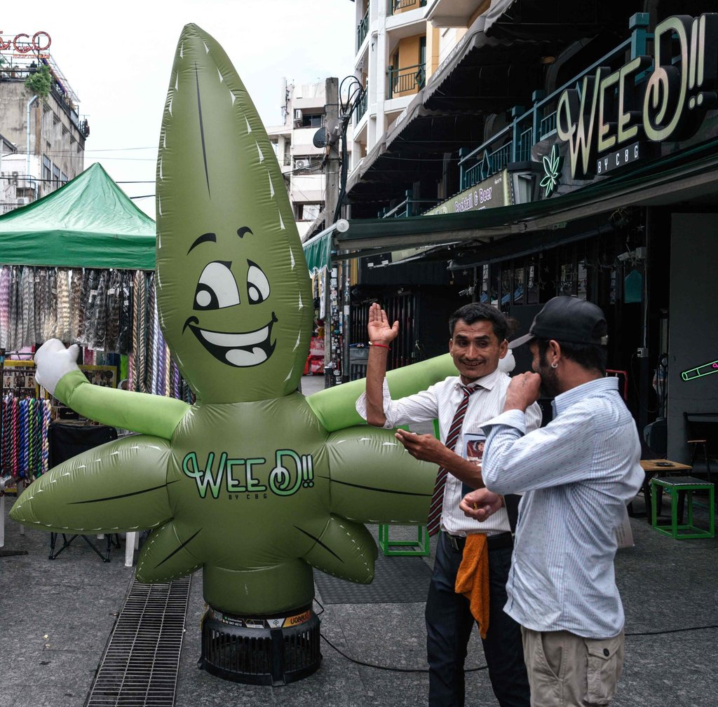 A marijuana leaf-shaped balloon in front of a cannabis dispensary on Khao San Road in Bangkok on Friday. Photo: AFP