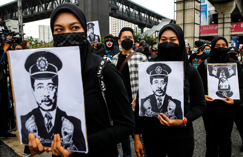 Protesters hold placards displaying Azam Baki’s face during a demonstration to demand that the MACC chief commissioner step down following a stock trading scandal on January 22, 2022. Photo: EPA-EFE Protesters hold placards displaying Azam Baki’s face during a demonstration to demand that the MACC chief commissioner step down following a stock trading scandal on January 22, 2022. Photo: EPA-EFE