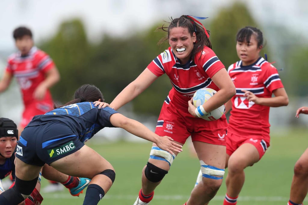 Shanna Forrest fends off a Japan player during Hong Kong’s defeat on Sunday. Photo: Hong Kong China Rugby