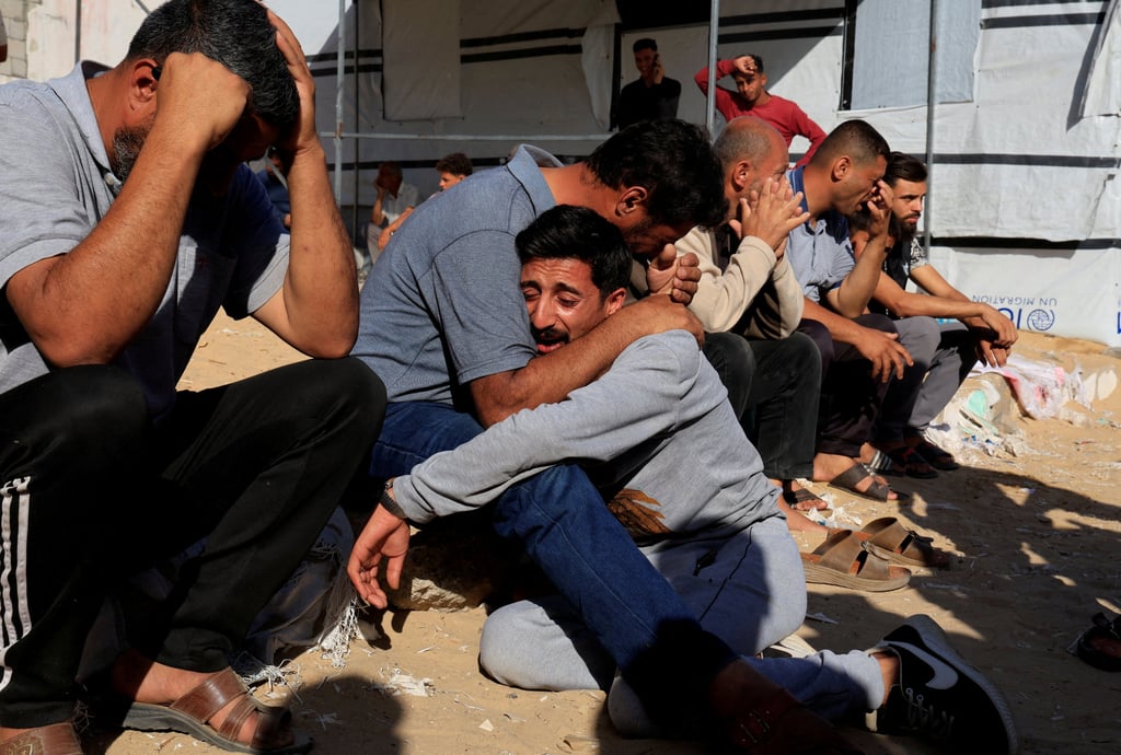 Mourners at a funeral for Palestinians killed in Israeli strikes, at Nasser hospital in Khan Younis, southern Gaza on Sunday. Photo: Reuters Mourners at a funeral for Palestinians killed in Israeli strikes, at Nasser hospital in Khan Younis, southern Gaza on Sunday. Photo: Reuters