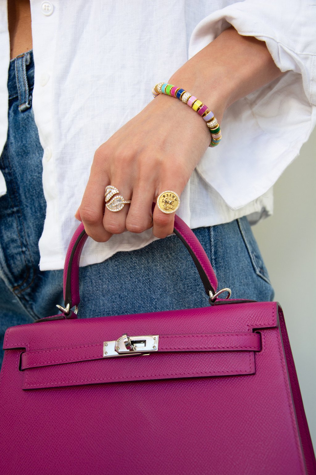 A Zodiac 18k gold and diamond ring by Anita Ko worn on the pinky finger. Photo: Handout