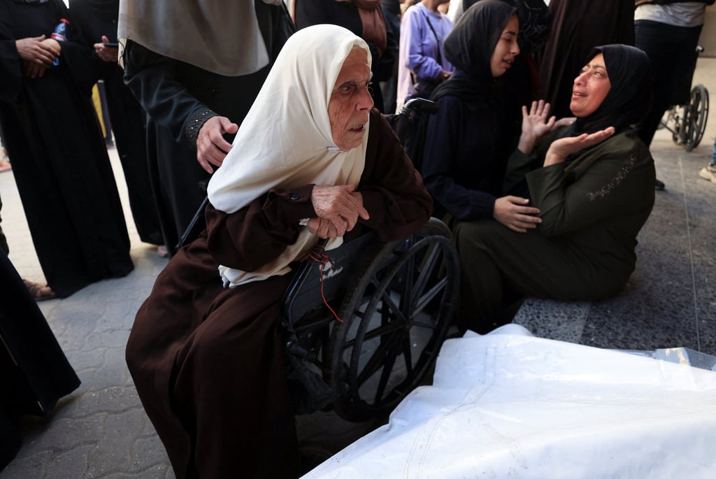 Mourners during the funeral of Palestinians killed in Israeli strikes, at Al-Ahli Arab Baptist hospital, in Gaza City. Photo: Reuters