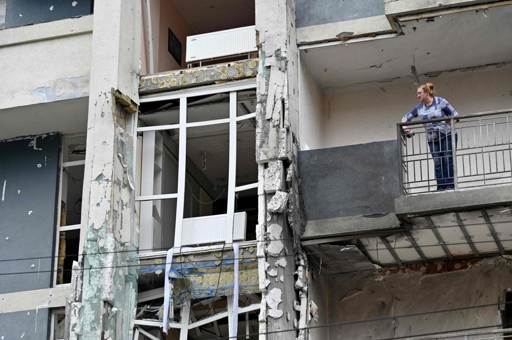 A resident stands on the terrace of a damaged flat following a drone strike in Kyiv. Photo: AFP A resident stands on the terrace of a damaged flat following a drone strike in Kyiv. Photo: AFP