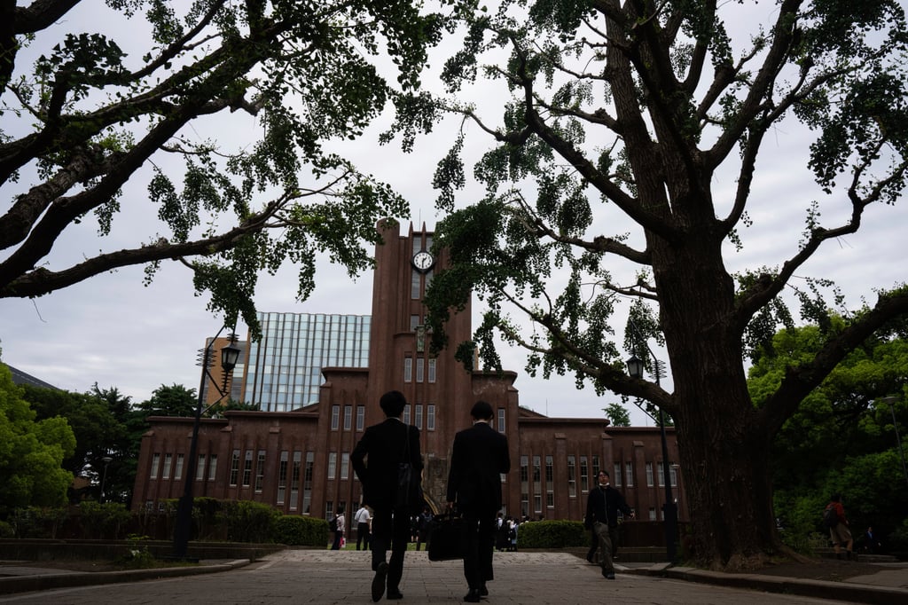 People walk along a road at the University of Tokyo on Tuesday. Photo: AP
