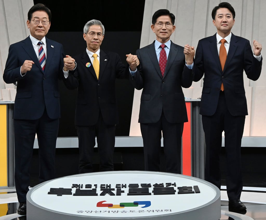 South Korea’s presidential candidates (from left) Lee Jae-myung, Kwon Young-guk, Kim Moon Soo and Lee Jun-seok ahead of the third televised presidential debate on Tuesday. Photo: Kyodo/AP South Korea’s presidential candidates (from left) Lee Jae-myung, Kwon Young-guk, Kim Moon Soo and Lee Jun-seok ahead of the third televised presidential debate on Tuesday. Photo: Kyodo/AP