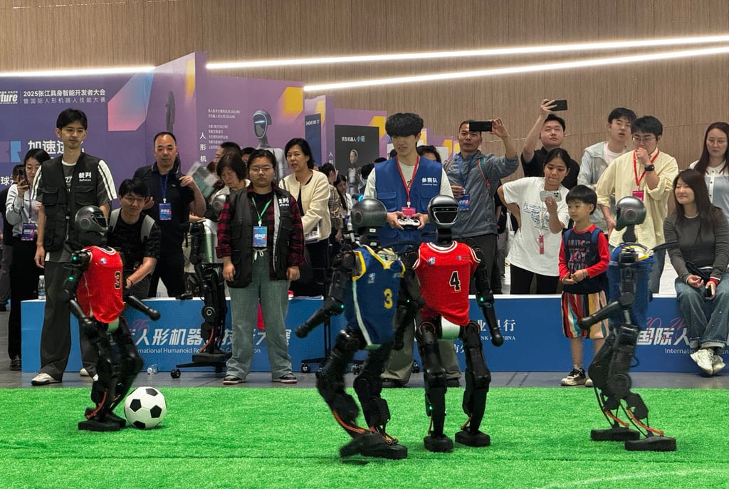 Humanoid robots play soccer at an event in Shanghai on Thursday. Photo: Wency Chen Humanoid robots play soccer at an event in Shanghai on Thursday. Photo: Wency Chen