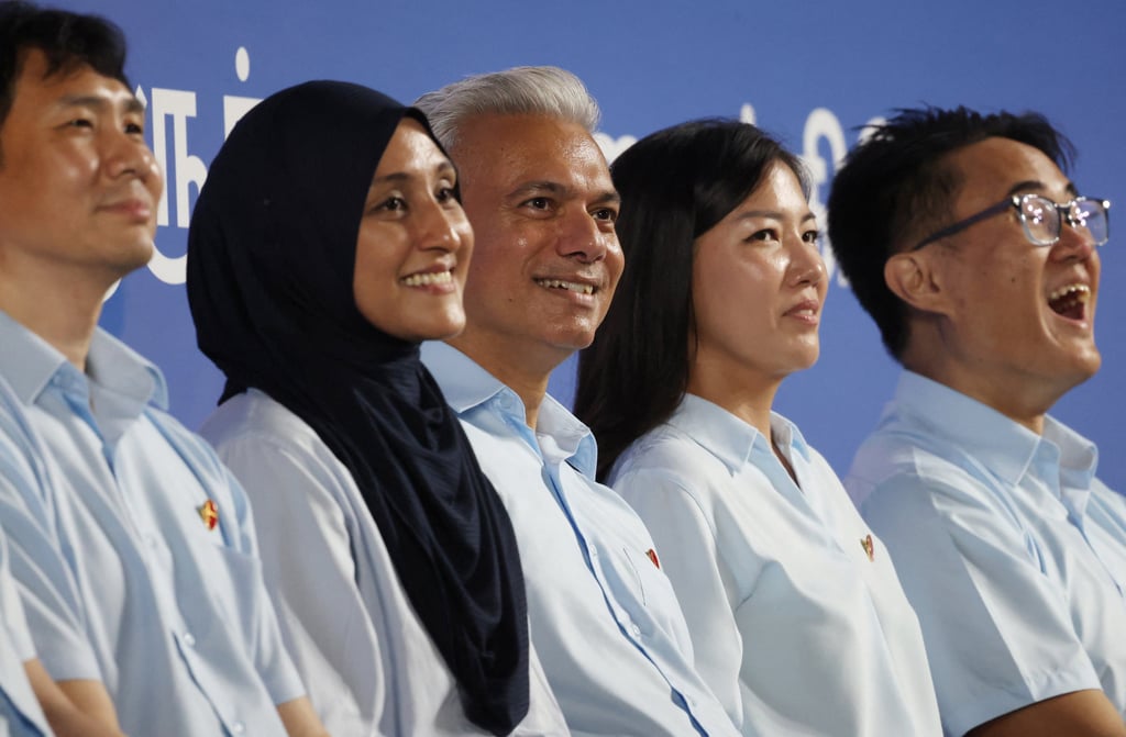 (From left) Workers’ Party candidates Jamus Lim, Siti Alia Abdul Rahim Mattar, Harpreet Singh, Alexis Dang and Jackson Au attend a rally ahead of the general election in Singapore on April 28. Photo: Reuters