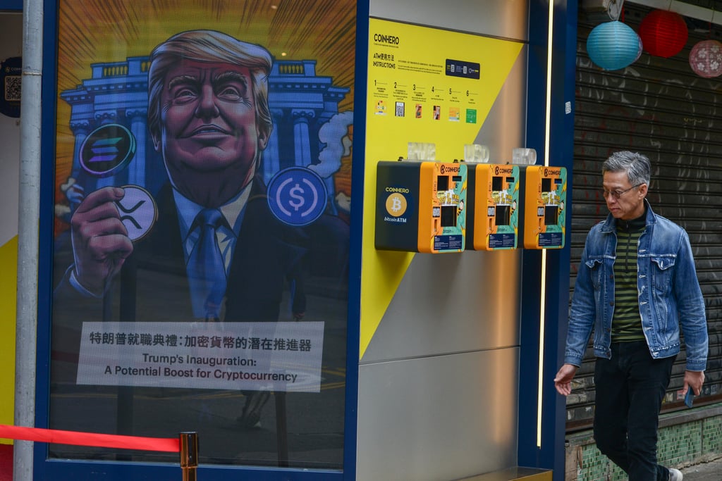 Pedestrians walk past a likeness of US President Donald Trump at a crypto exchange in Hong Kong on January 31. Photo: Antony Dickson Pedestrians walk past a likeness of US President Donald Trump at a crypto exchange in Hong Kong on January 31. Photo: Antony Dickson