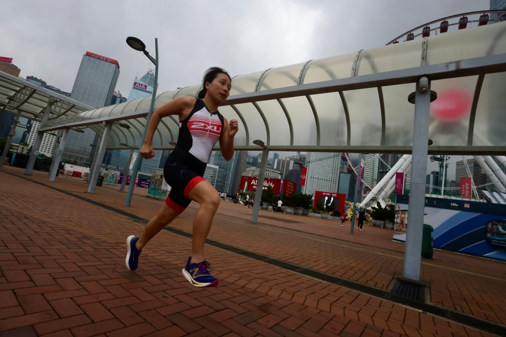 Swimming and running coach Sophie Lai, one of the organisers of the Middle Island Challenge, runs in Central, Hong Kong. Photo: Jonathan Wong Swimming and running coach Sophie Lai, one of the organisers of the Middle Island Challenge, runs in Central, Hong Kong. Photo: Jonathan Wong