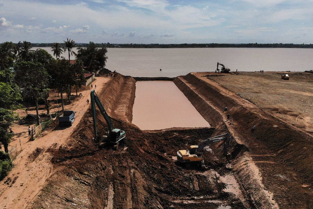 Workers use excavators to dig the Funan Techo Canal along the Prek Takeo channel that runs into the Mekong River in Cambodia. Photo: AFP