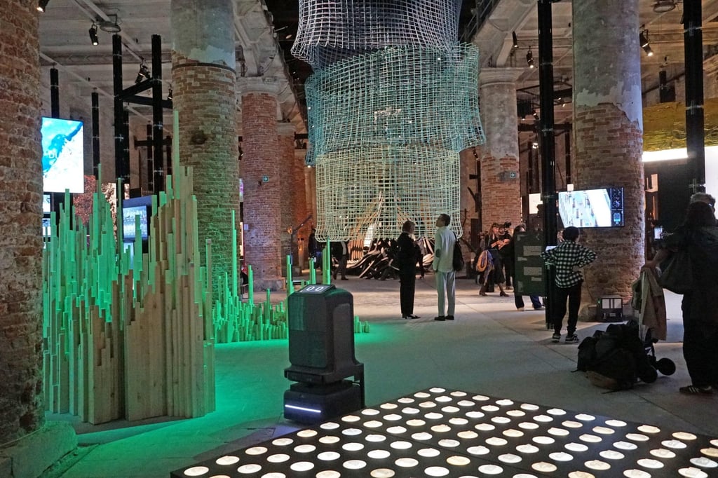 People visit the main exhibition, titled “Intelligens. Natural. Artificial. Collective.” and curated by Italian architect-engineer Carlo Ratti, at the Corderie dell’Arsenale, on May 7. Photo: EPA-EFE