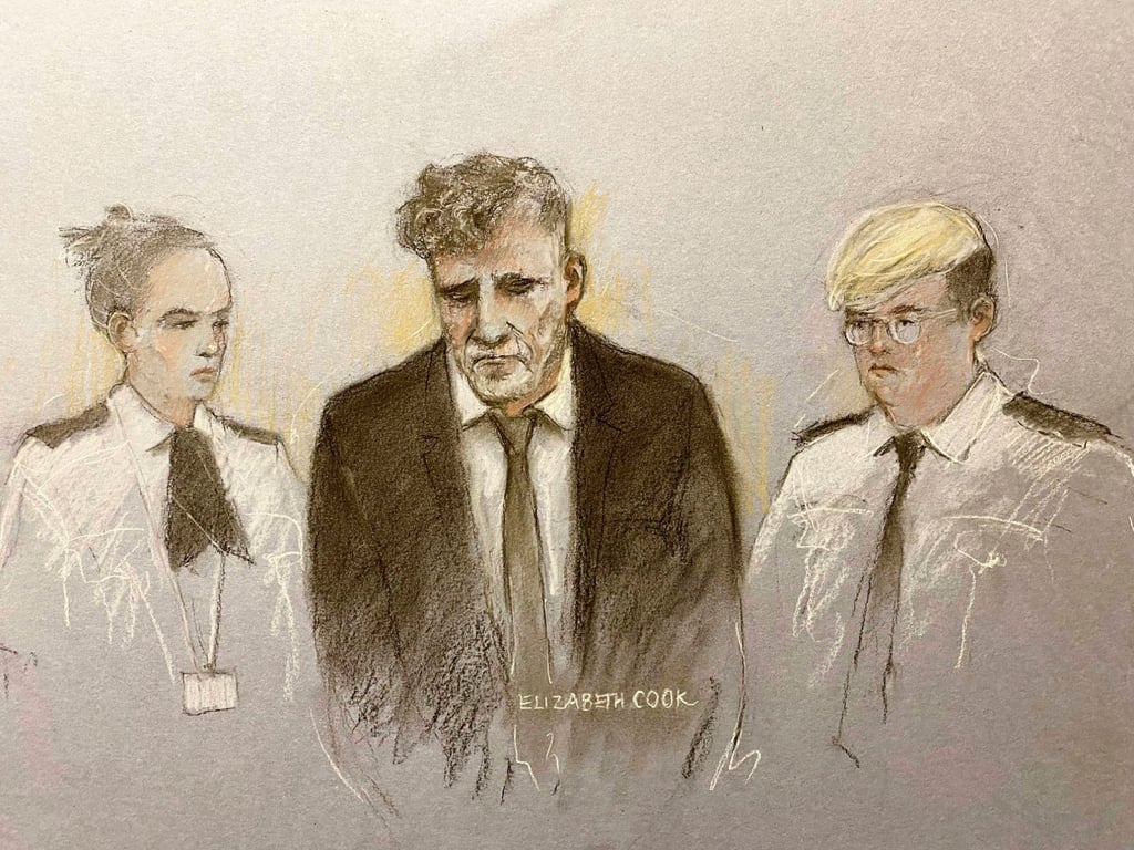 A court sketch of Paul Doyle (middle) at Liverpool Magistrates’ Court, where he was remanded in custody charged with seven offences. Photo: via AP
