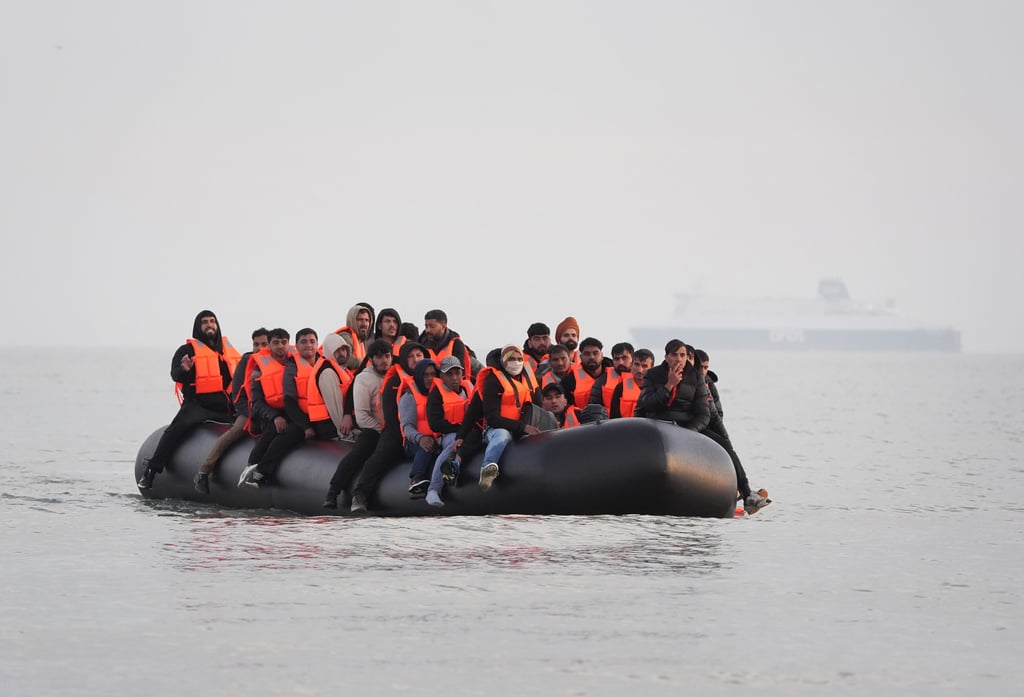 A group of people thought to be migrants leave the beach at Gravelines, France, attempting to reach the UK by crossing the English Channel. Photo: PA via dpa