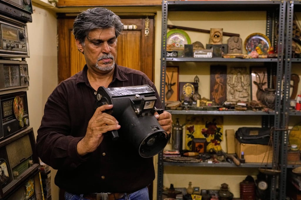 Vij with a handheld camera made by American brand Graflex that was used by the US Army during World War II. Photo: AP Vij with a handheld camera made by American brand Graflex that was used by the US Army during World War II. Photo: AP