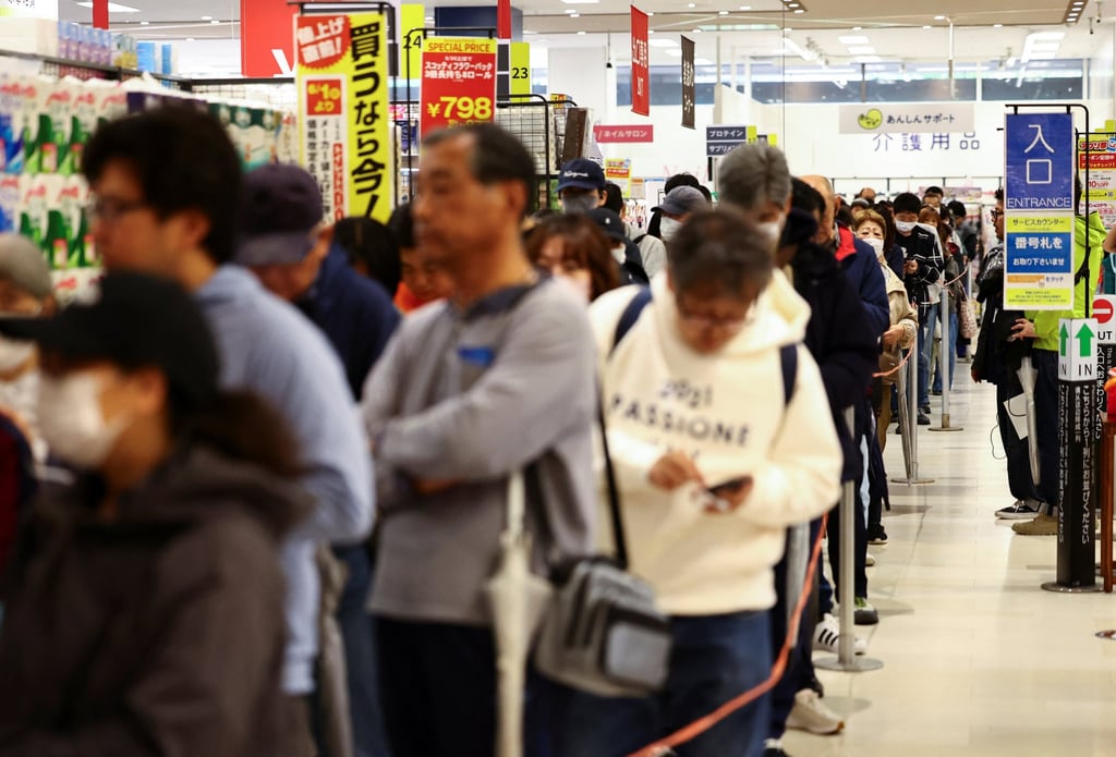People queue up to buy government-stockpiled rice at an Ito Yokado outlet in Tokyo on Saturday. Photo: Reuters People queue up to buy government-stockpiled rice at an Ito Yokado outlet in Tokyo on Saturday. Photo: Reuters