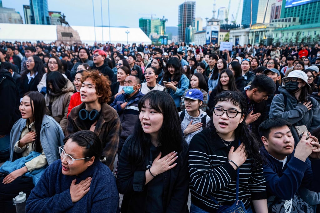 People sing during a protest in Ulaanbaatar on May 21 calling for the resignation of Mongolia’s Prime Minister Luvsannamsrain Oyun-Erdene. Photo: AFP People sing during a protest in Ulaanbaatar on May 21 calling for the resignation of Mongolia’s Prime Minister Luvsannamsrain Oyun-Erdene. Photo: AFP