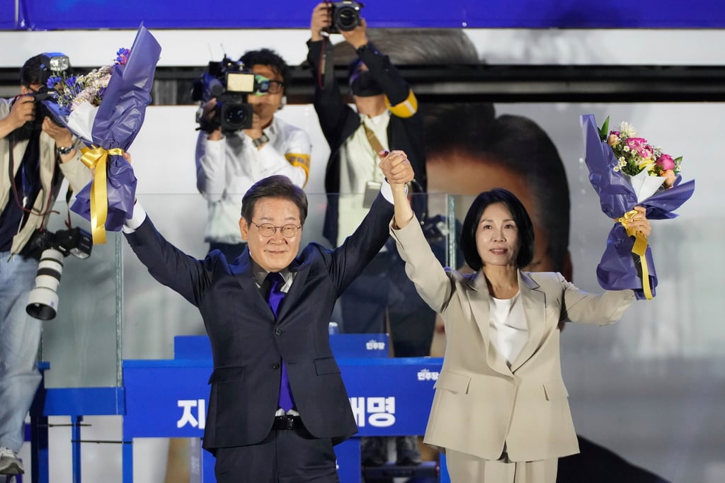 South Korea’s president-elect Lee Jae-myung and his wife, Kim Hea-kyung, celebrate outside the National Assembly in Seoul on Wednesday. Photo: AP South Korea’s president-elect Lee Jae-myung and his wife, Kim Hea-kyung, celebrate outside the National Assembly in Seoul on Wednesday. Photo: AP