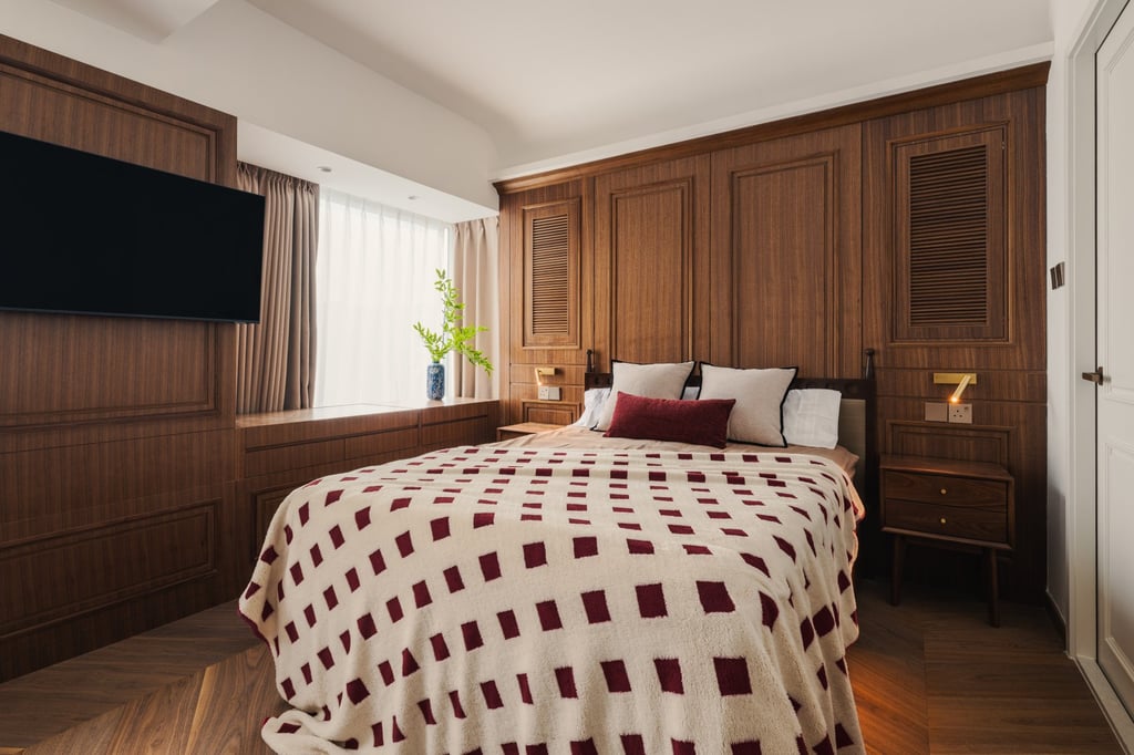 Like the rest of Leung’s apartment, the bedroom favours rich timber hues for a British colonial touch. Photo: courtesy Win Key Workshop
