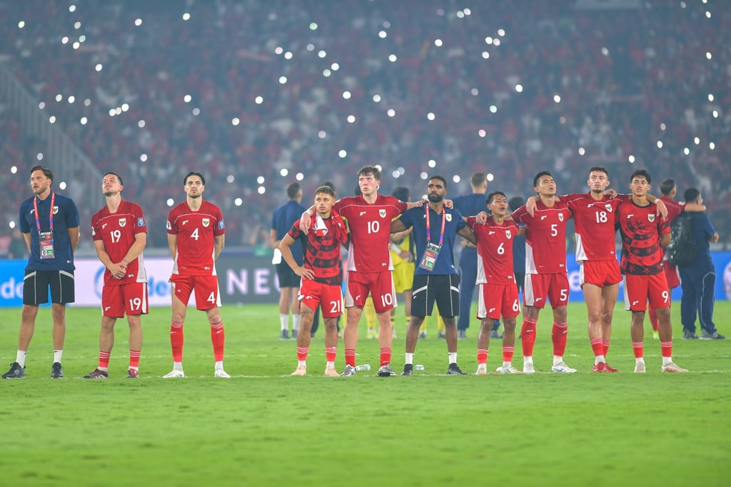 Indonesia players take in the celebrations after their victory over China. Photo: Xinhua