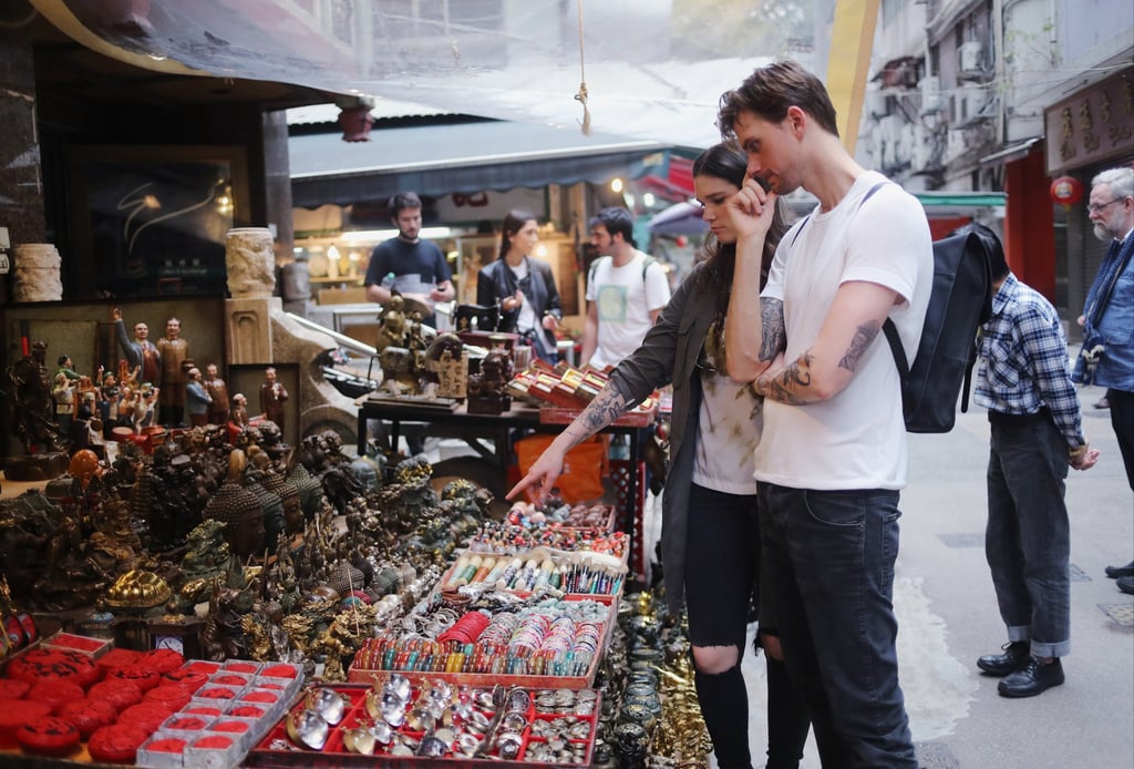 Tourists browse among the second-hand and curio stalls at Upper Lascar Row. Photo: Winson Wong Tourists browse among the second-hand and curio stalls at Upper Lascar Row. Photo: Winson Wong