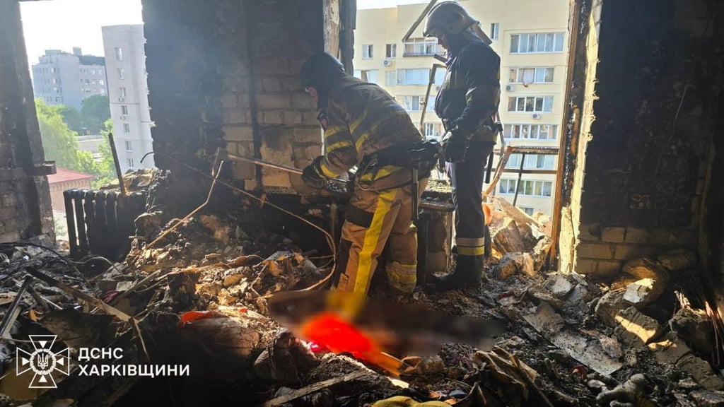 Rescuers at the site of an air strike in Kharkiv, northeastern Ukraine, on Saturday. Photo: EPA-EFE/State Emergency Service of Ukraine.